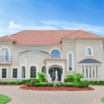 Large White Mansion with a Red Roof