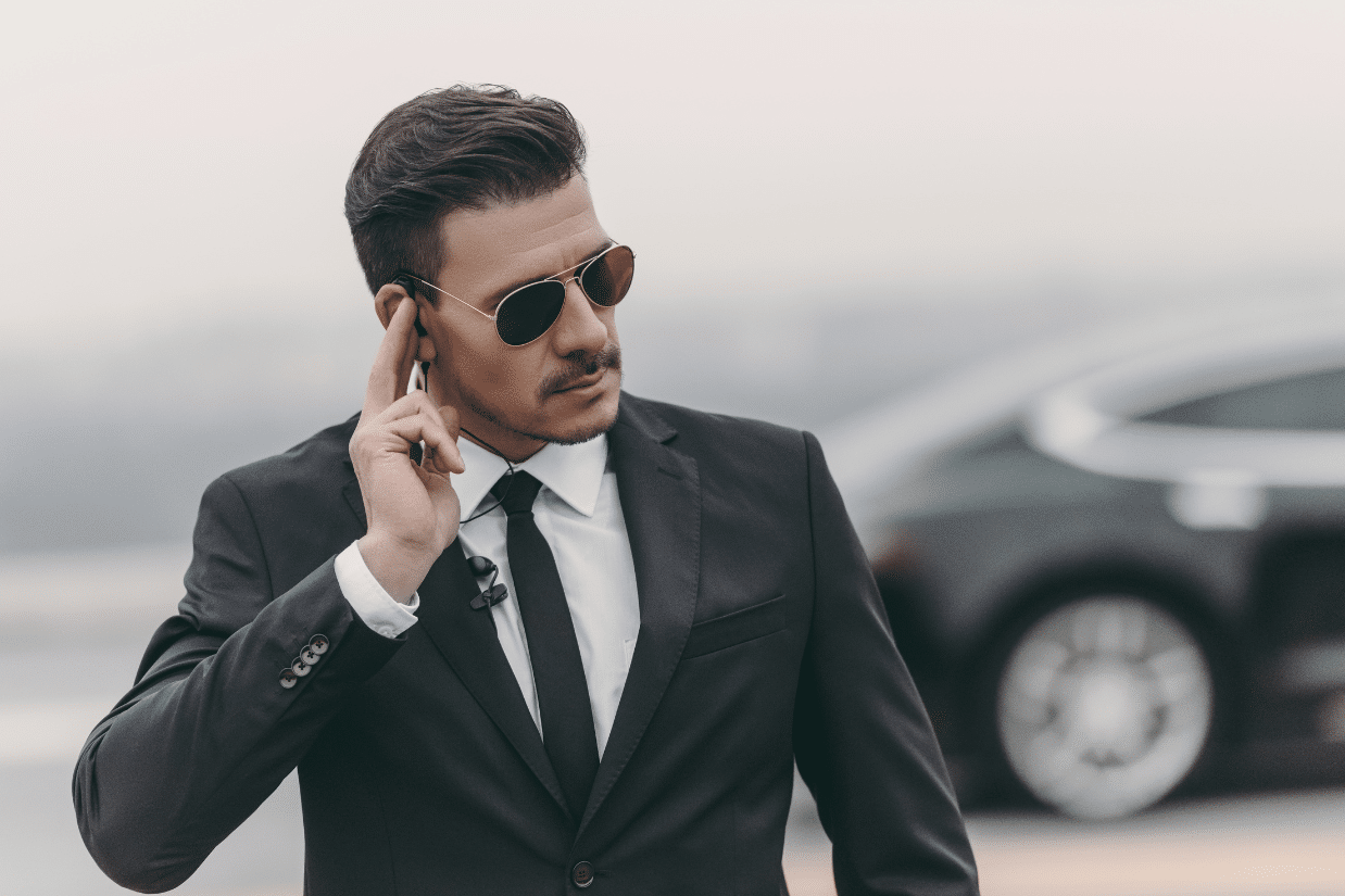 Security guard with ear monitor