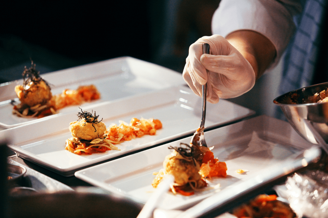 Chef plating items on a dish